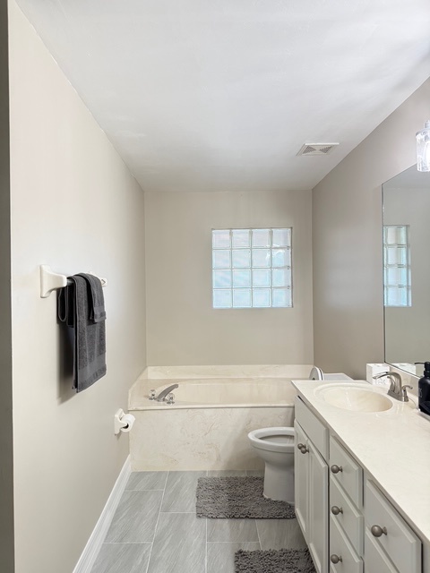 Main bathroom Unwind in your private bathroom sanctuary with a deep soaking tub, perfect for melting away the day's adventures.