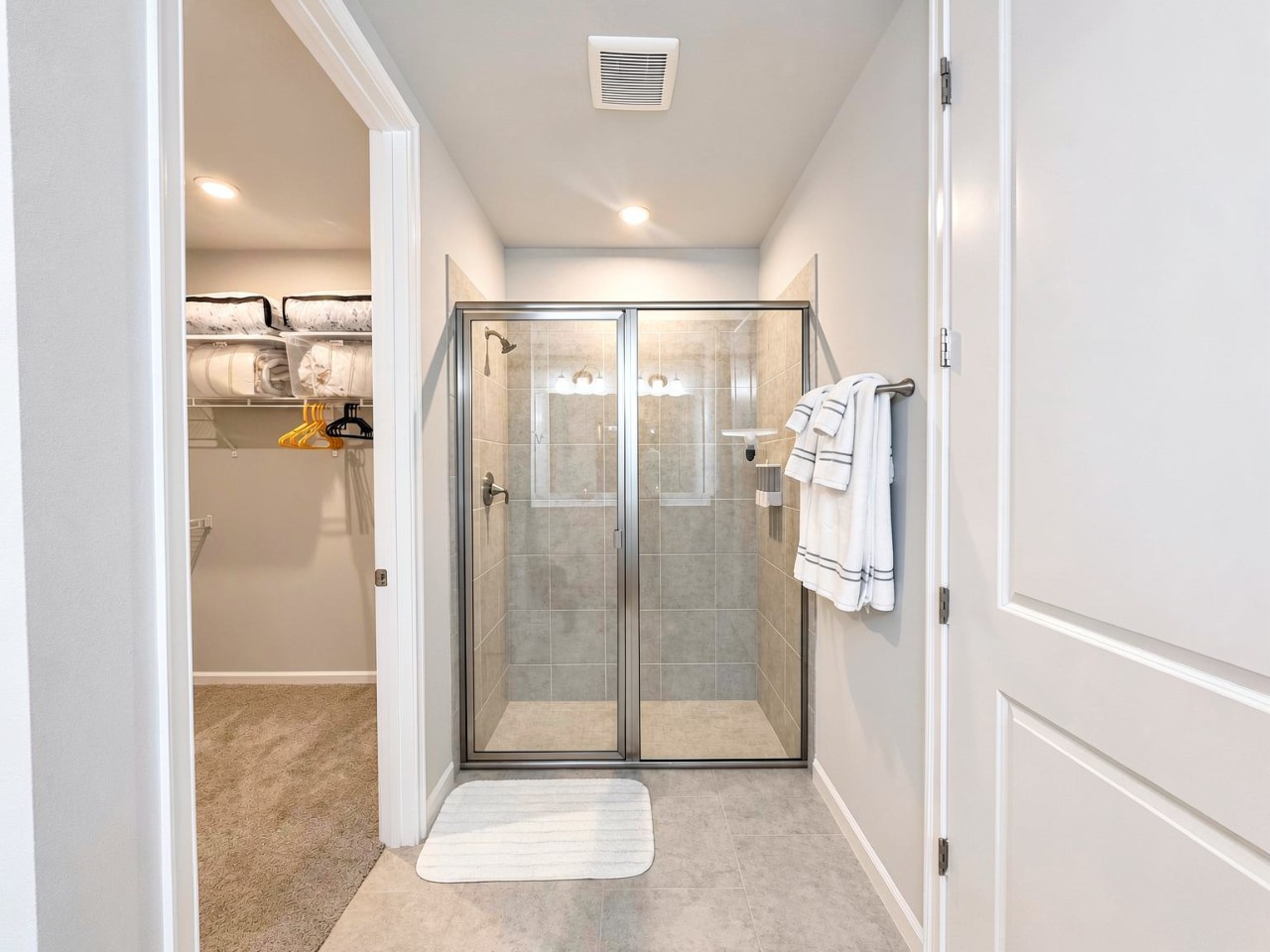 Rinse off the day in your private walk-in shower with modern glass doors and plush towels waiting. Clean, bright, and ready for your arrival.