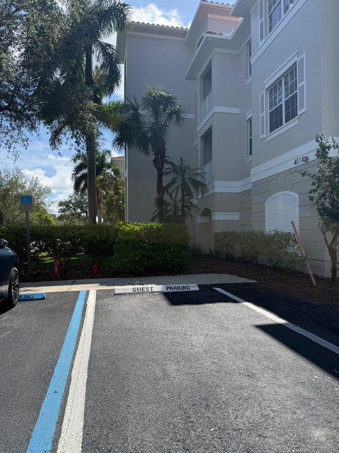 Your rental is located within a well-maintained tropical complex with dedicated guest parking and lush palm landscaping that sets a relaxing tone before you even step inside.