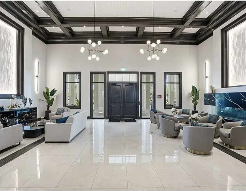 Step into a sophisticated lobby where elegant coffered ceilings and modern chandeliers create an inviting first impression. Plush seating areas and sleek finishes set the tone for your refined getaway.