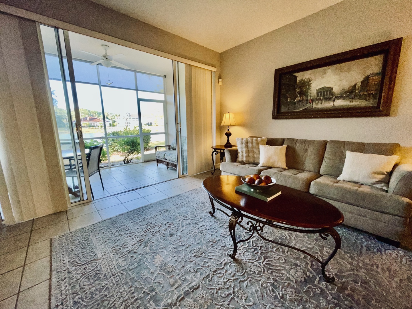 Sink into the plush sofa and enjoy your morning coffee at the elegant oval table, with sliding doors opening to your private patio.