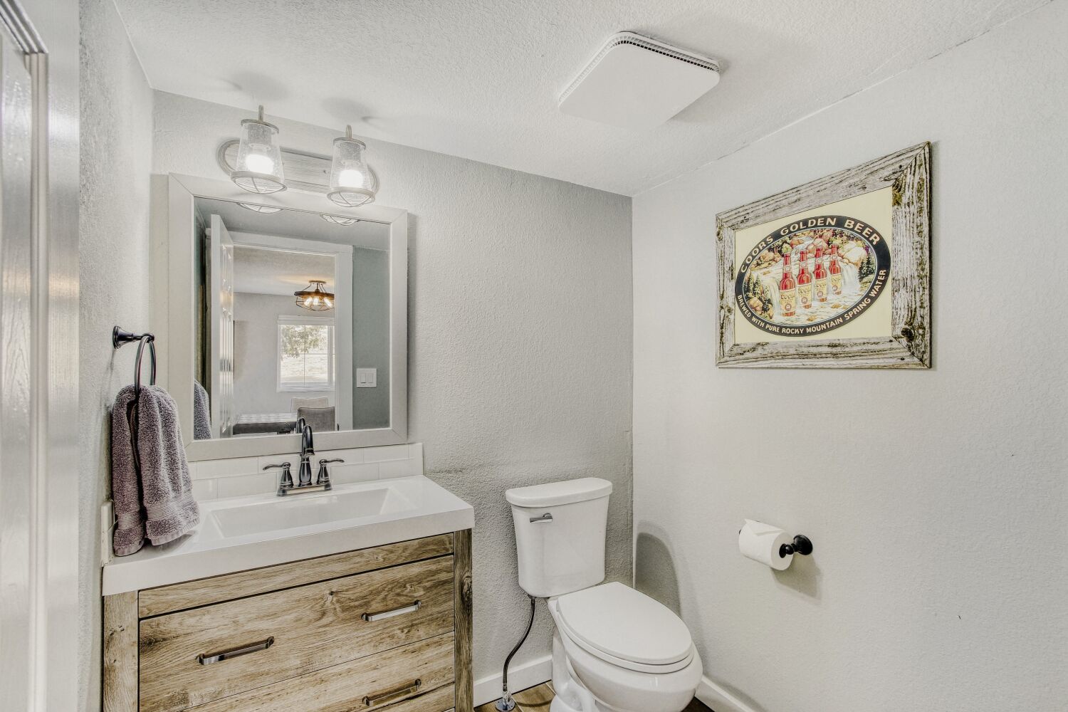 Your well-appointed bathroom features modern fixtures, warm wood vanity, and charming vintage touches that make freshening up feel like a treat.