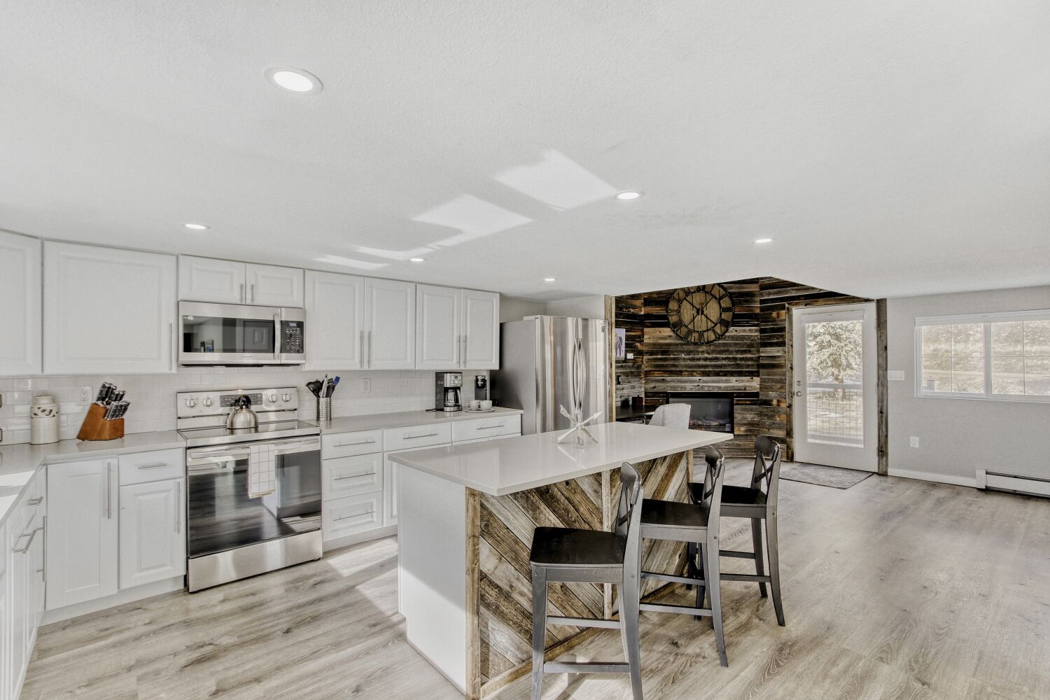 Your spacious kitchen invites culinary adventures with modern appliances, gleaming countertops, and a cozy breakfast island where you'll start each morning.
