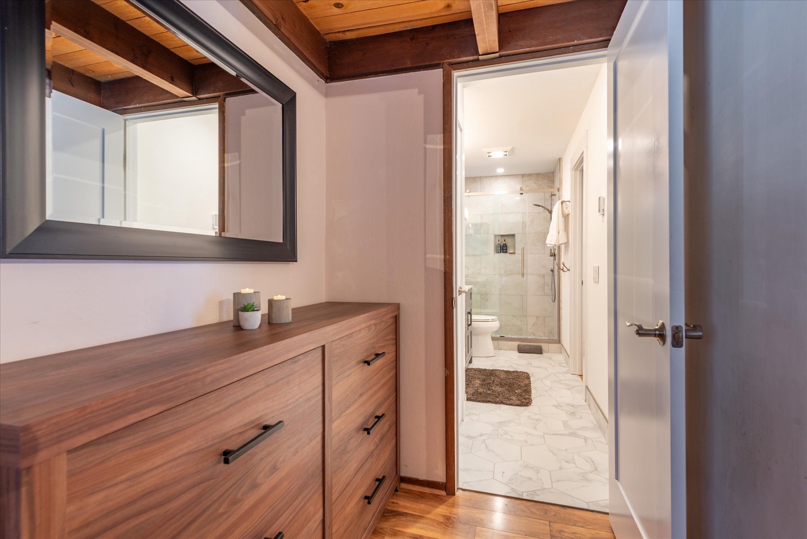 Your private ensuite features modern touches and a spacious walk-in shower for ultimate comfort.