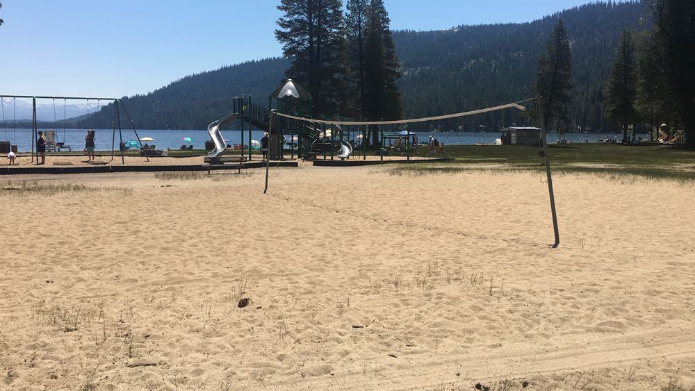 Sandy lakefront beach with volleyball court and playground, at West End Beach walkable from your property.