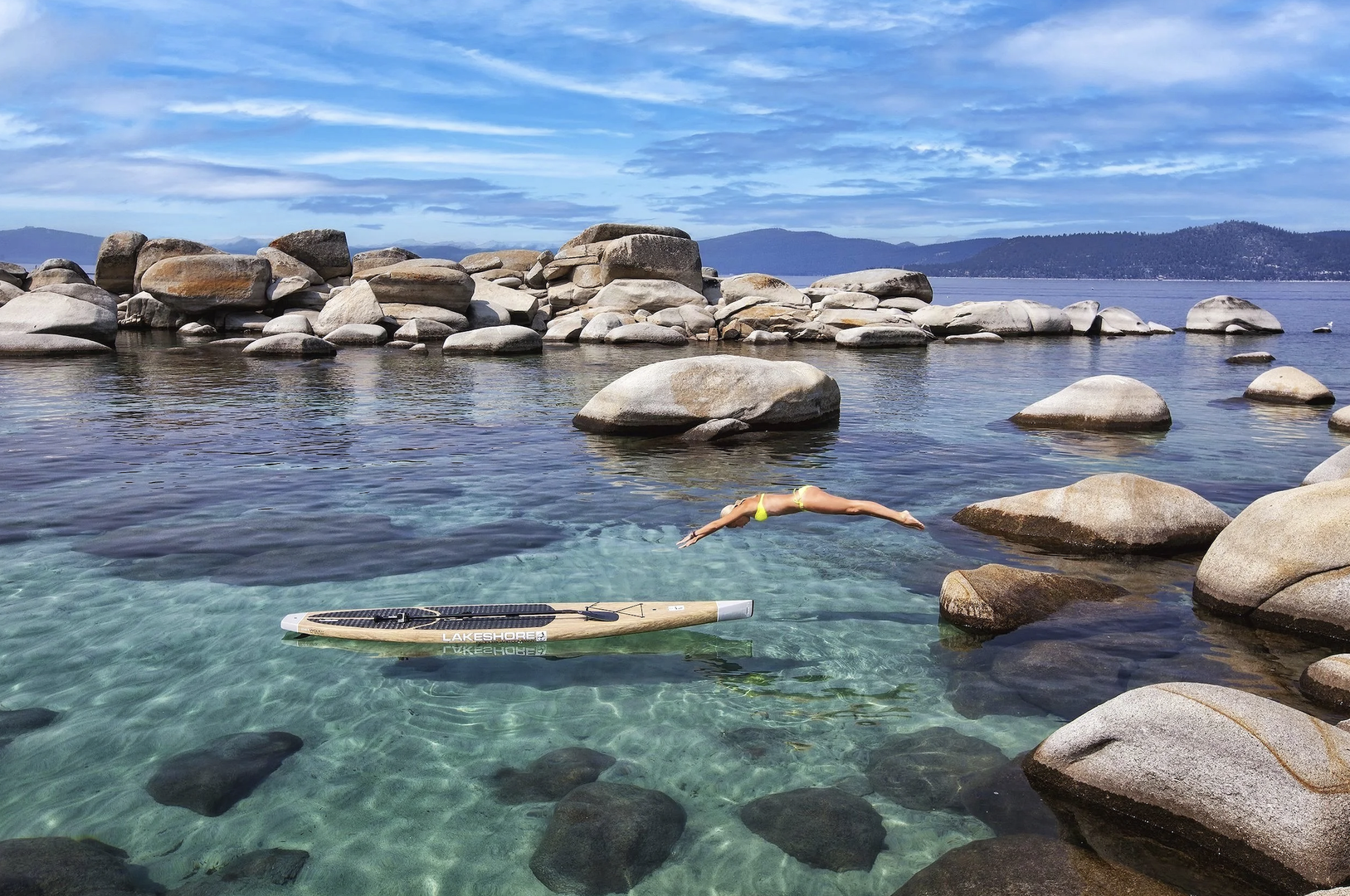 Crystal-clear waters and granite boulders create the perfect swimming spot, with paddleboard adventures waiting for you.