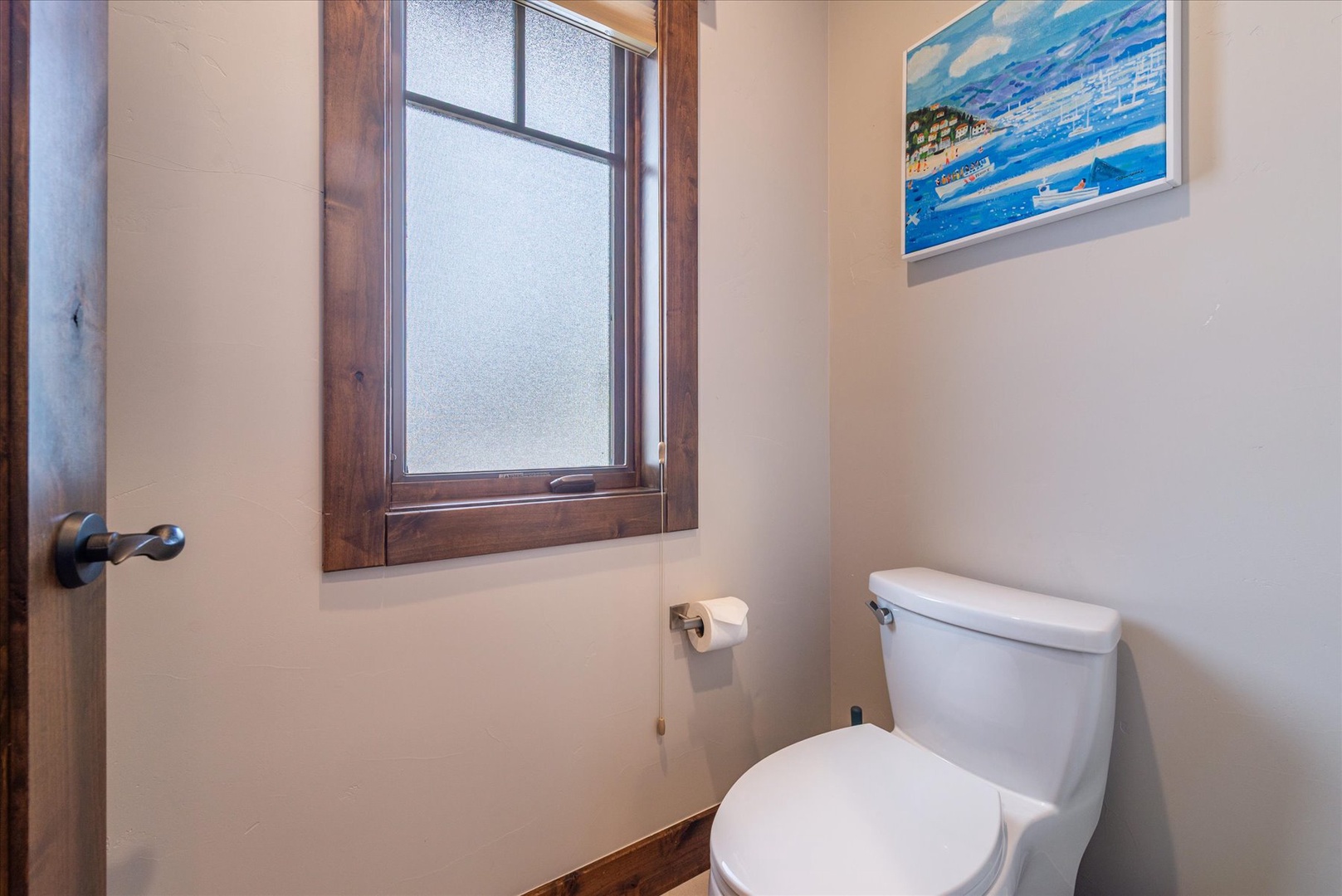 Your private bathroom features natural light from a frosted window, creating a bright and airy atmosphere for your comfort.
