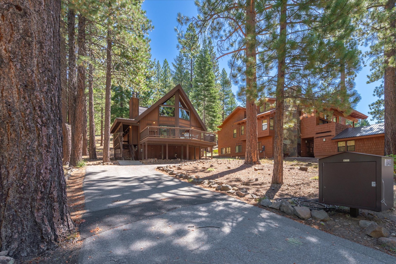 This inviting mountain retreat features warm wood construction and a spacious private driveway, welcoming you to your peaceful forest escape.