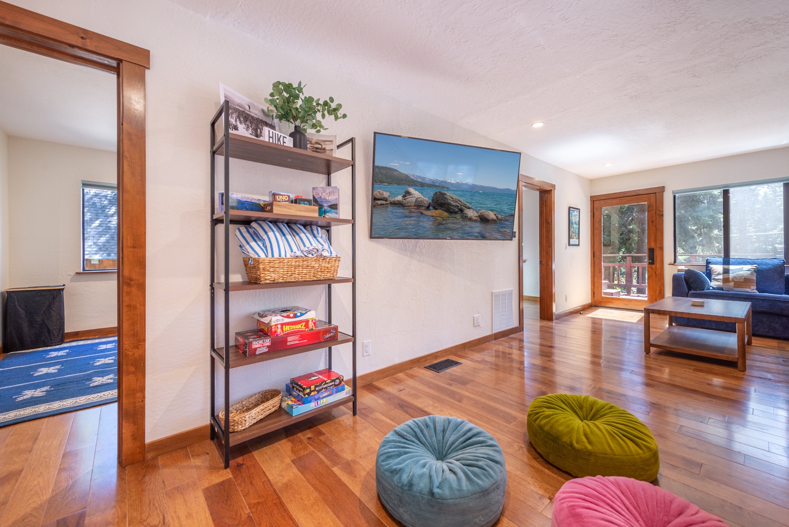 Step into your bright living space and curl up on the couch or colorful floor cushions, browse the game collection, or put your favorite movie on.
