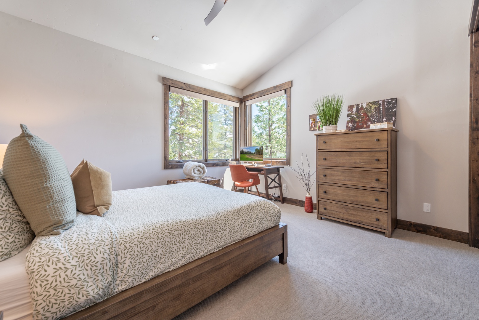 Your peaceful retreat features a comfortable bed, natural forest views, and thoughtful furnishings for a restful stay.