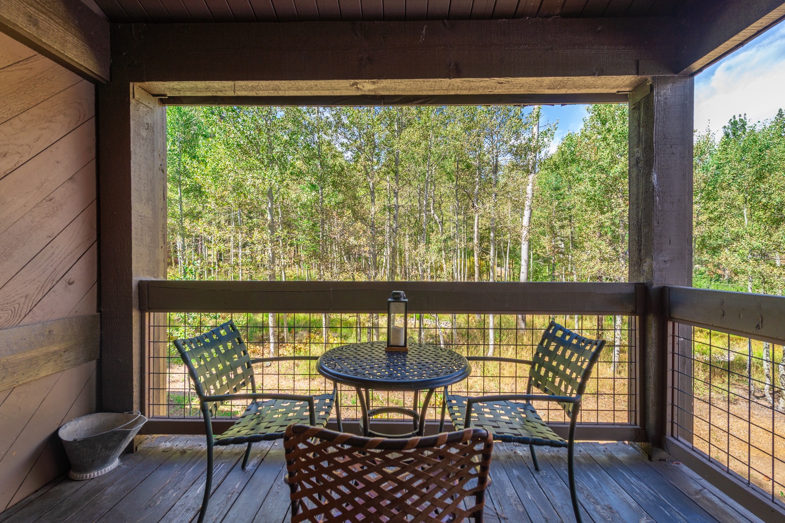 Sip your morning coffee on your private balcony, where towering aspens create a peaceful canopy and frame your own slice of nature's serenity.