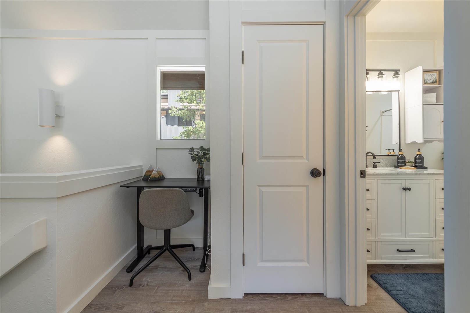 A clean, modern workspace tucked beside the bathroom offers you a bright, efficient spot to catch up on emails or plan your next adventure.