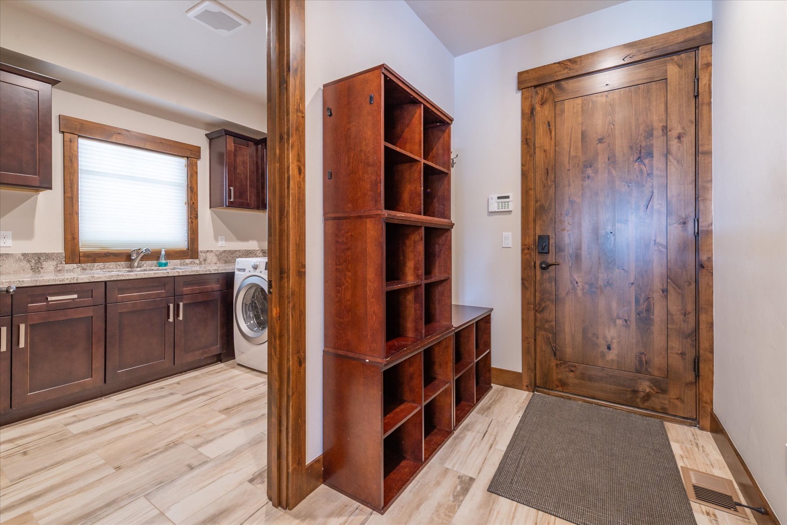 Shoes off in our home please! Your entryway off the garage welcomes you with custom storage cubbies, say all your gear can stay organized.