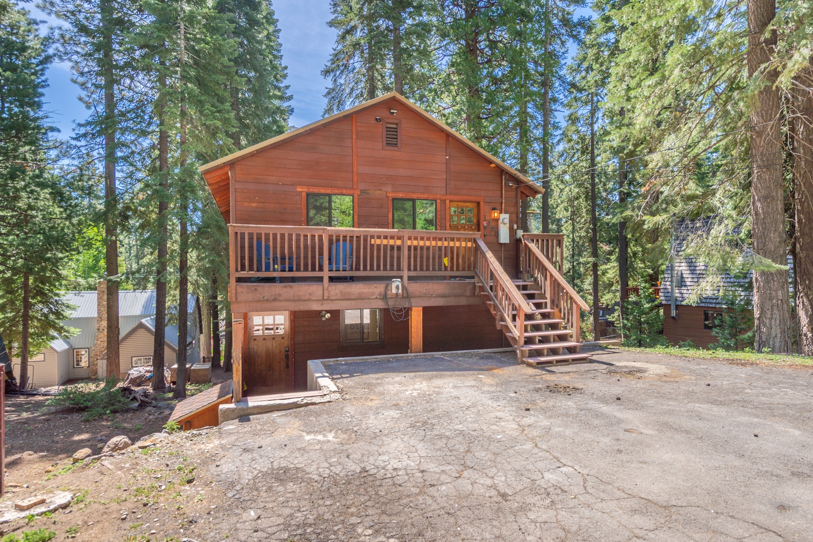 This charming two-story cedar cabin sits nestled among towering pines, featuring a spacious deck and convenient parking. The property offers a private forested setting perfect for a peaceful mountain getaway.