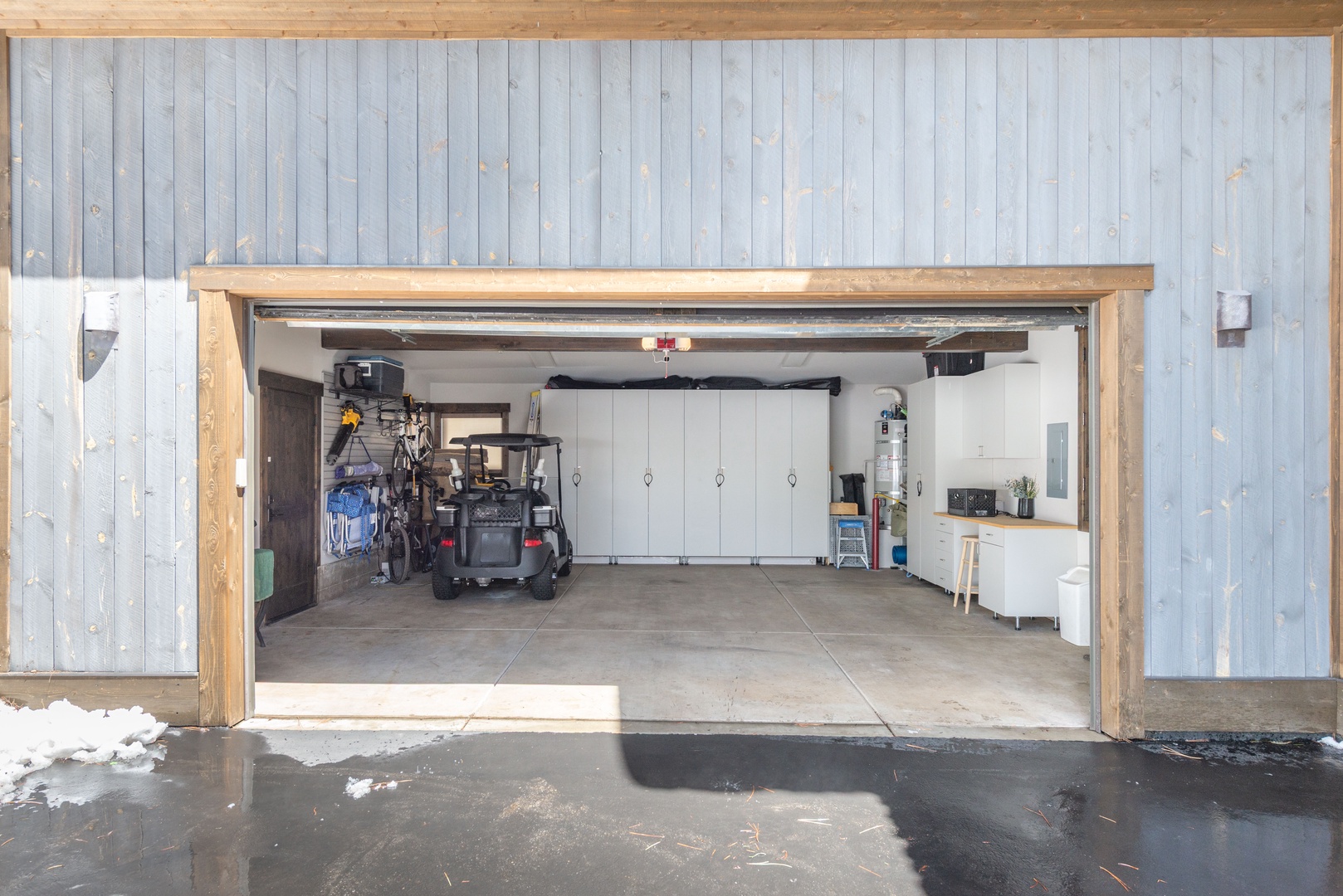 Spacious garage with convenient storage and workspace areas for your gear and equipment needs.