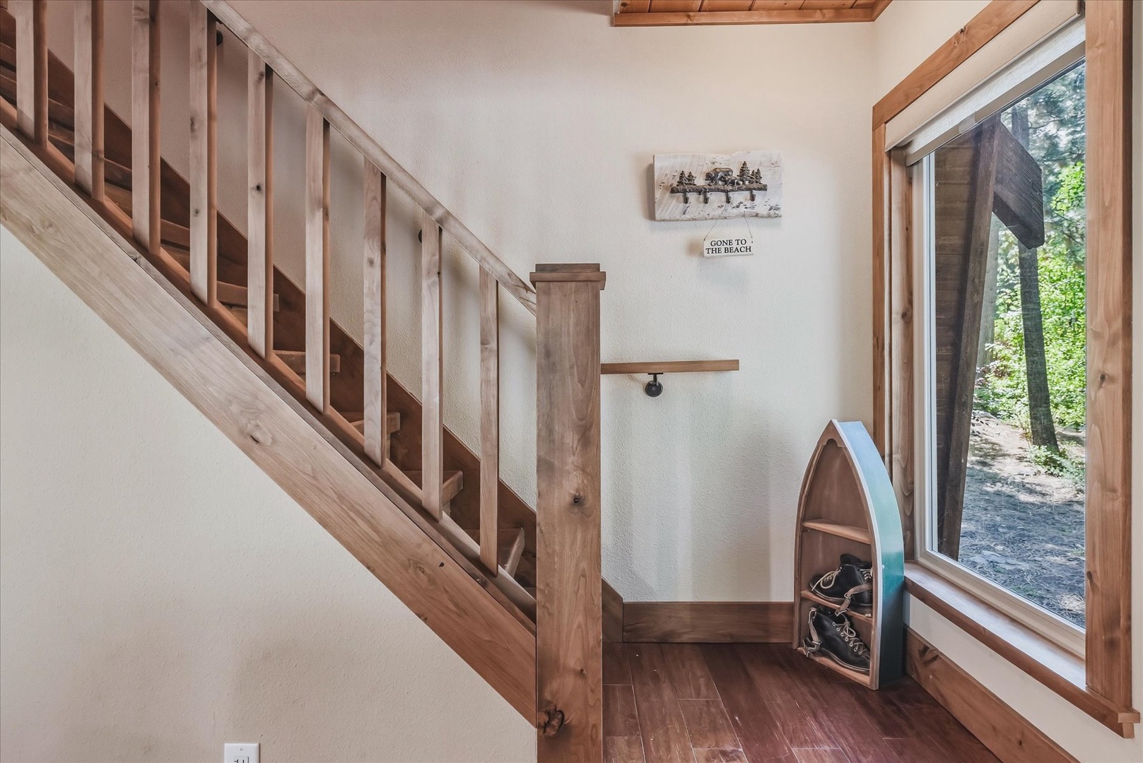 The stairway to the upstairs bedrooms and bathroom, with a charming landing..