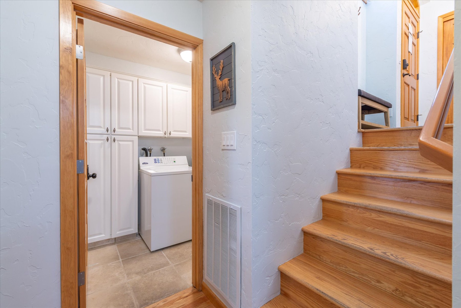 The downstairs landing with stairs leading to the upper level of the home.