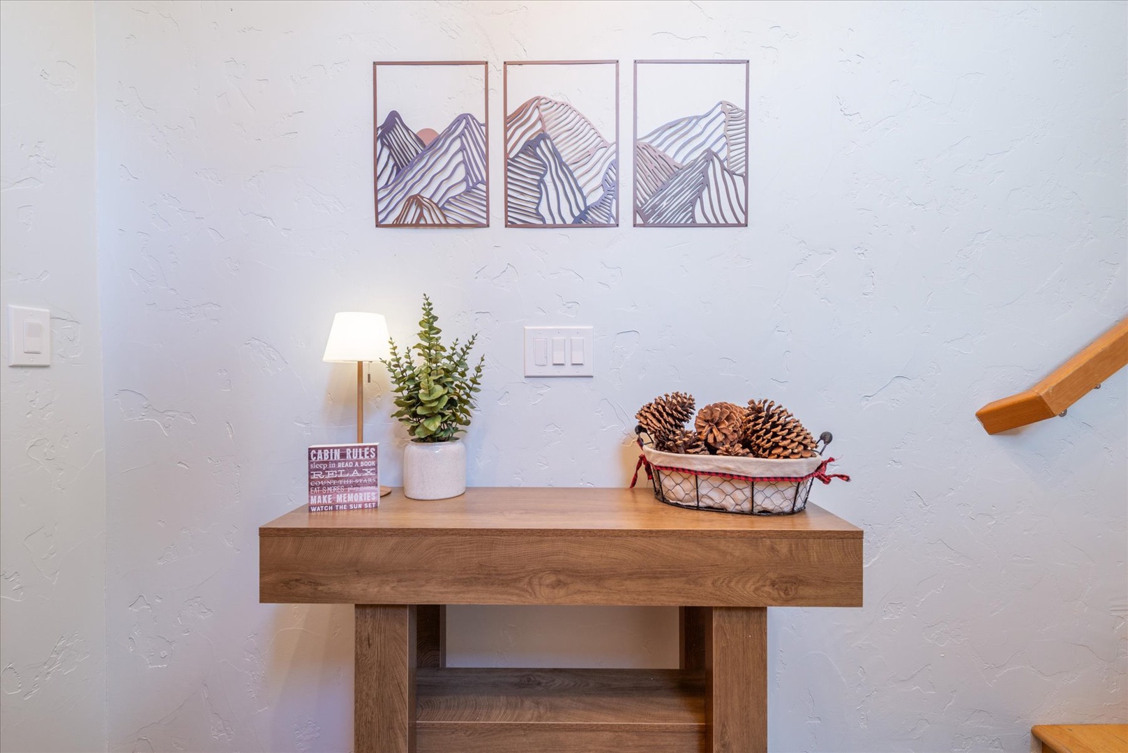 A cozy touch of mountain charm welcomes you at the entry, with nature-inspired artwork and thoughtful details designed to make your stay feel like home.