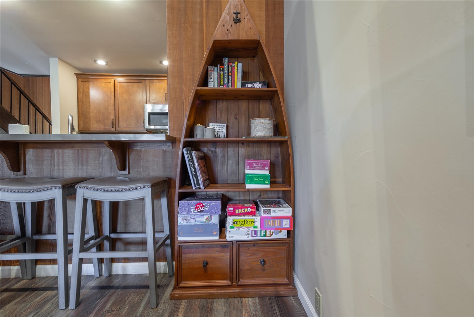 Pick out a games for the whole family from this boat-shaped game cupboard.