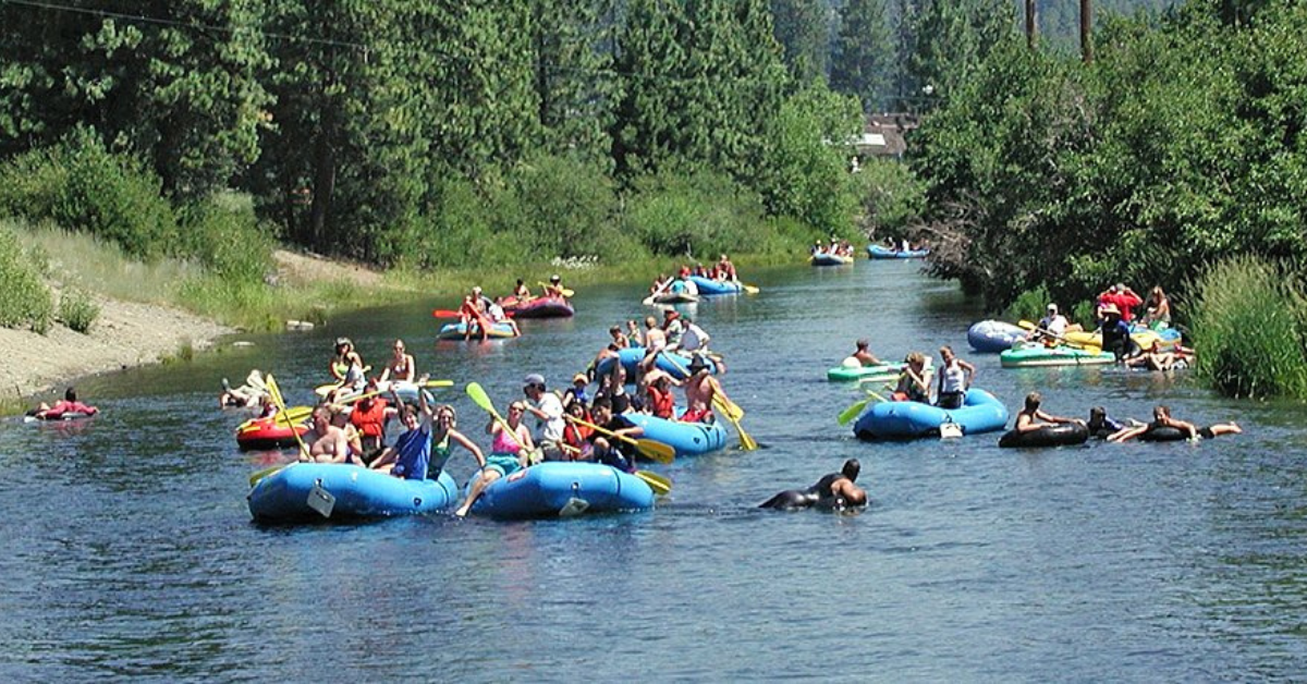 A popular summer tubing and water recreation spot on the nearby river, offering visitors a fun outdoor activity surrounded by lush, tree-lined scenery.