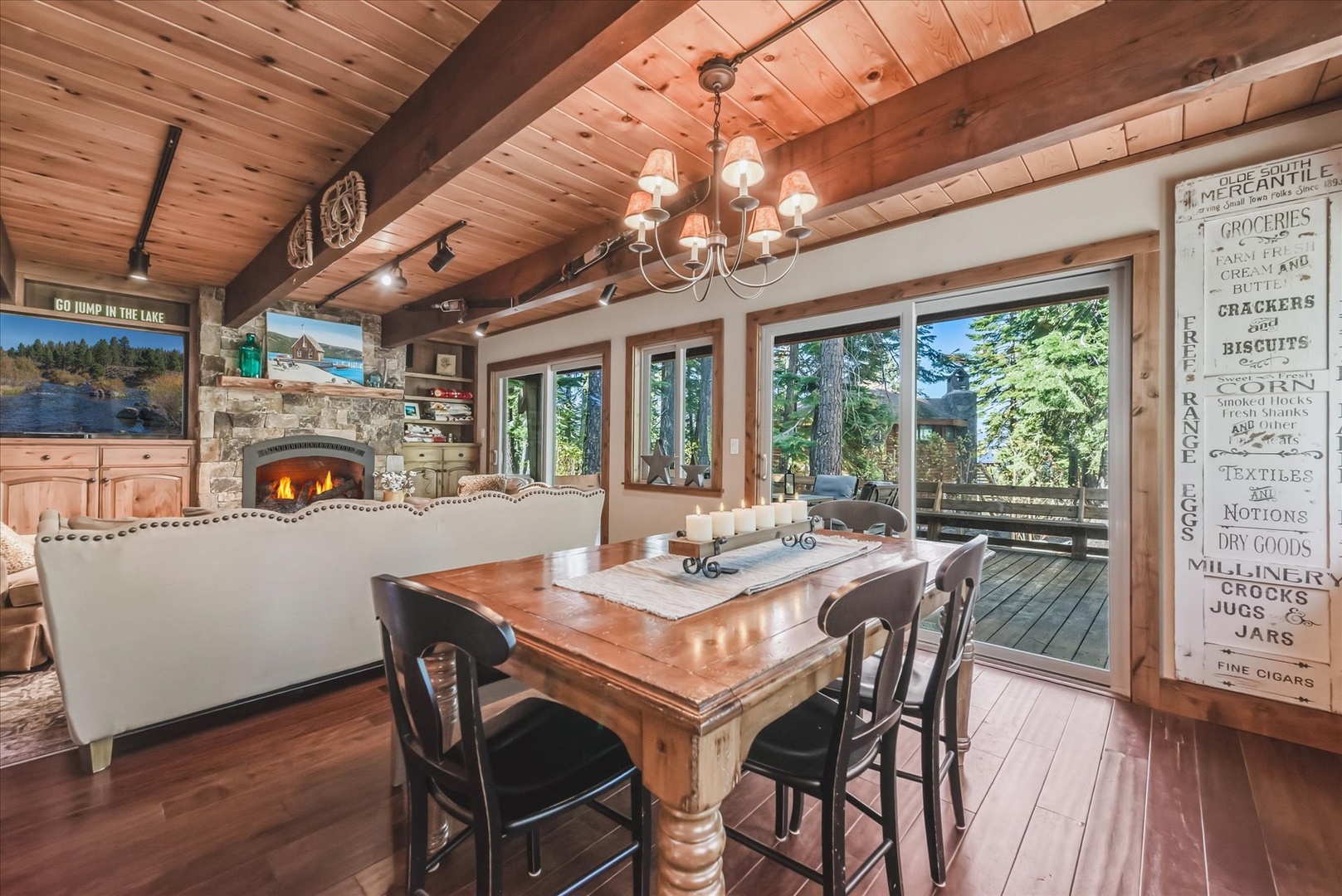 Gather around the farmhouse table with plenty of space to share a meal with friends and family under warm chandelier light.