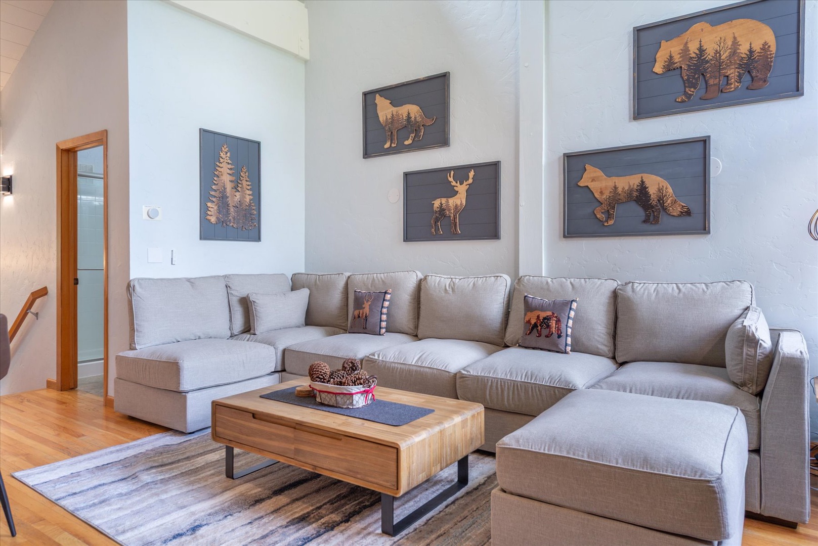 Sink into plush cushions on this spacious brand new sectional and soak in the mountain-lodge charm.