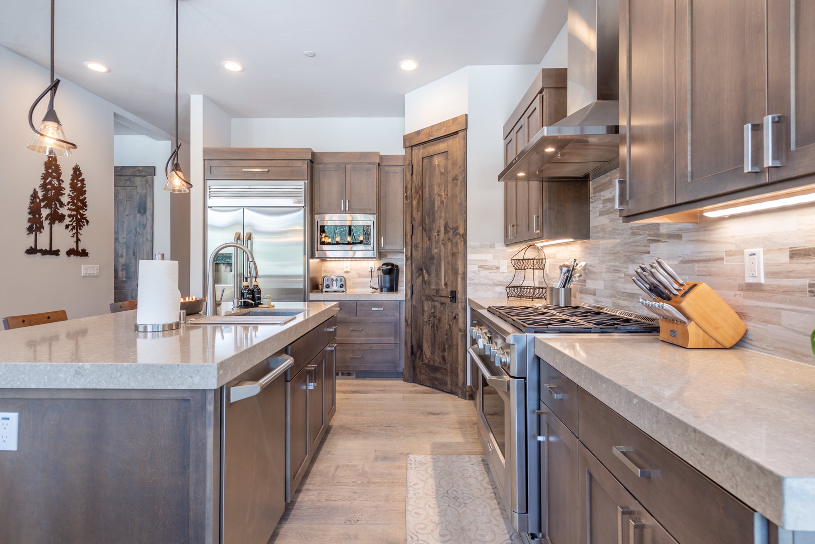 Your gourmet kitchen awaits with premium appliances, stunning countertops, and warm wood accents for memorable cooking experiences.