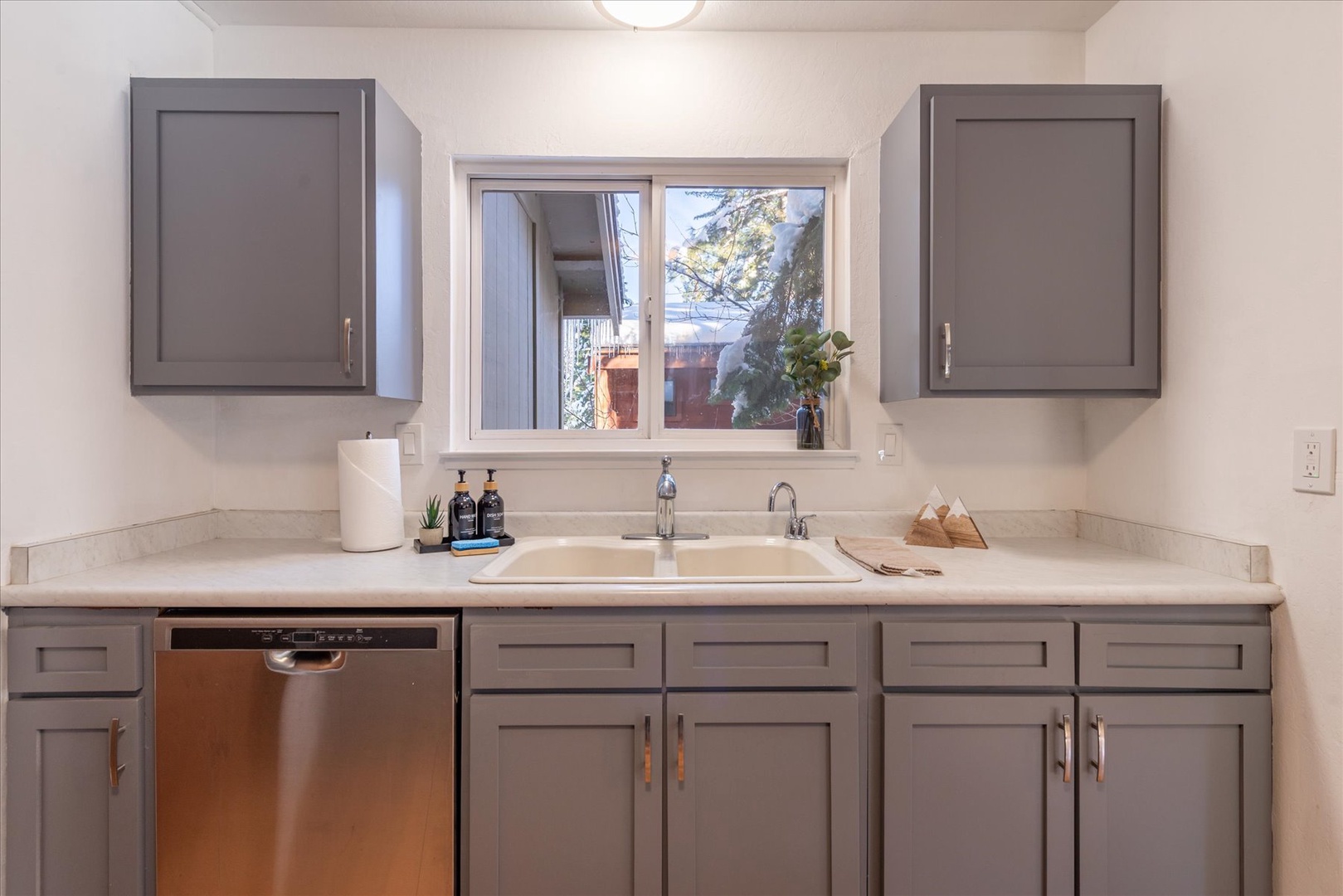 Enjoy all the kitchen amenities including a dishwasher and provided soaps and sponges.