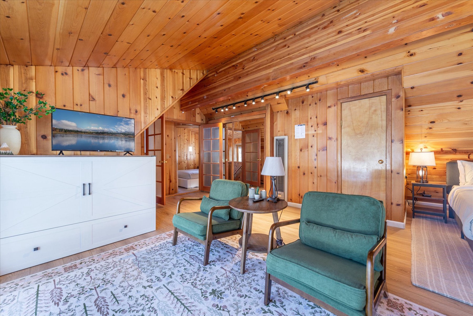 This space also functions for extra sleeping as the white cabinet pulls out into a trundle bed.