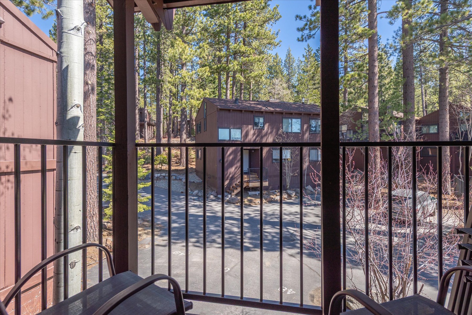 Step onto your private balcony and breathe in the fresh mountain air surrounded by towering pines and peaceful forest views.
