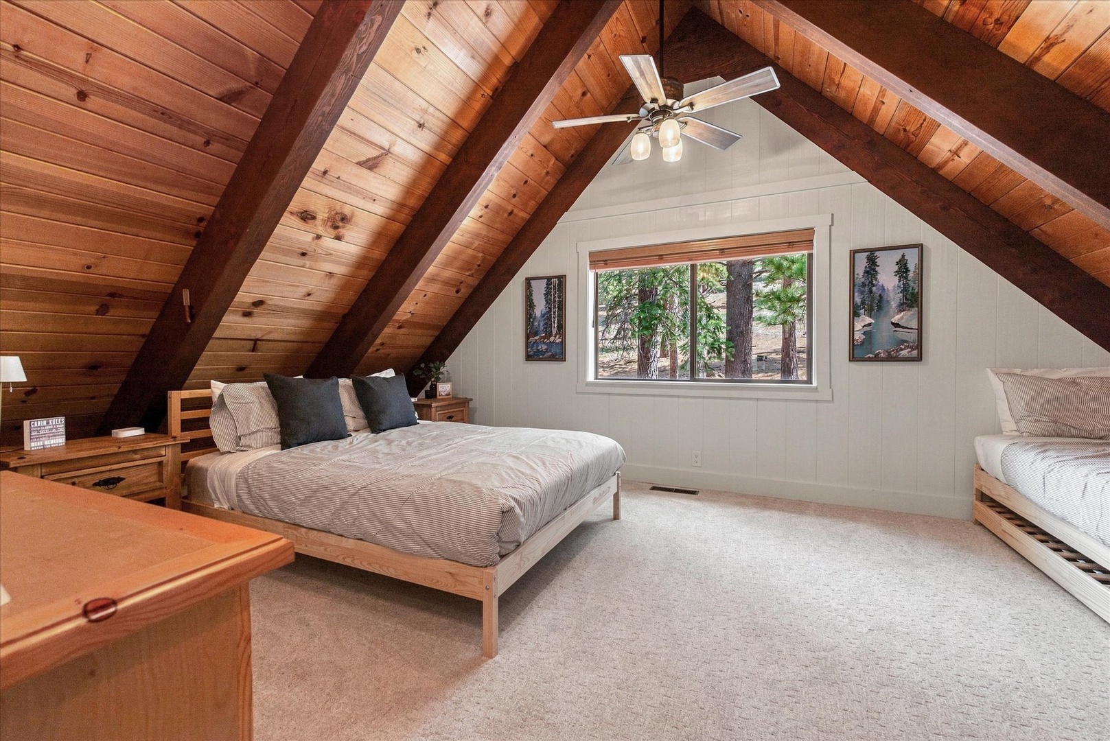 Drift off in this spacious and peaceful upstairs bedroom with forest views.