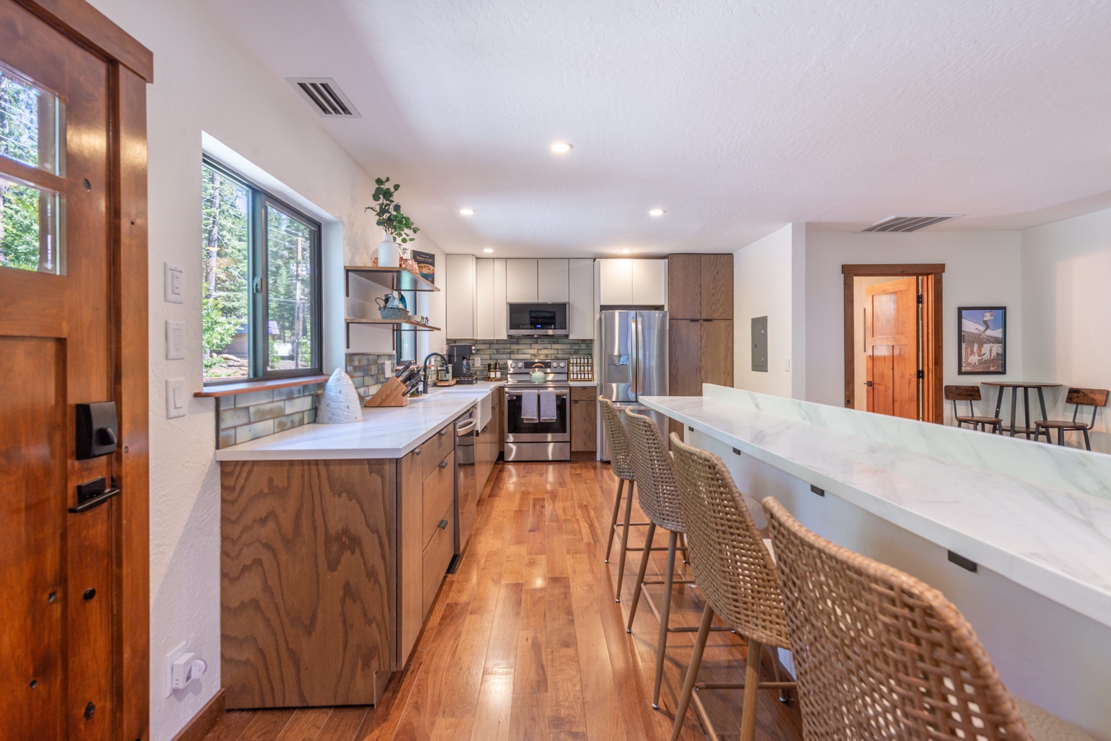 Your gourmet kitchen blends modern convenience with warm, natural textures..