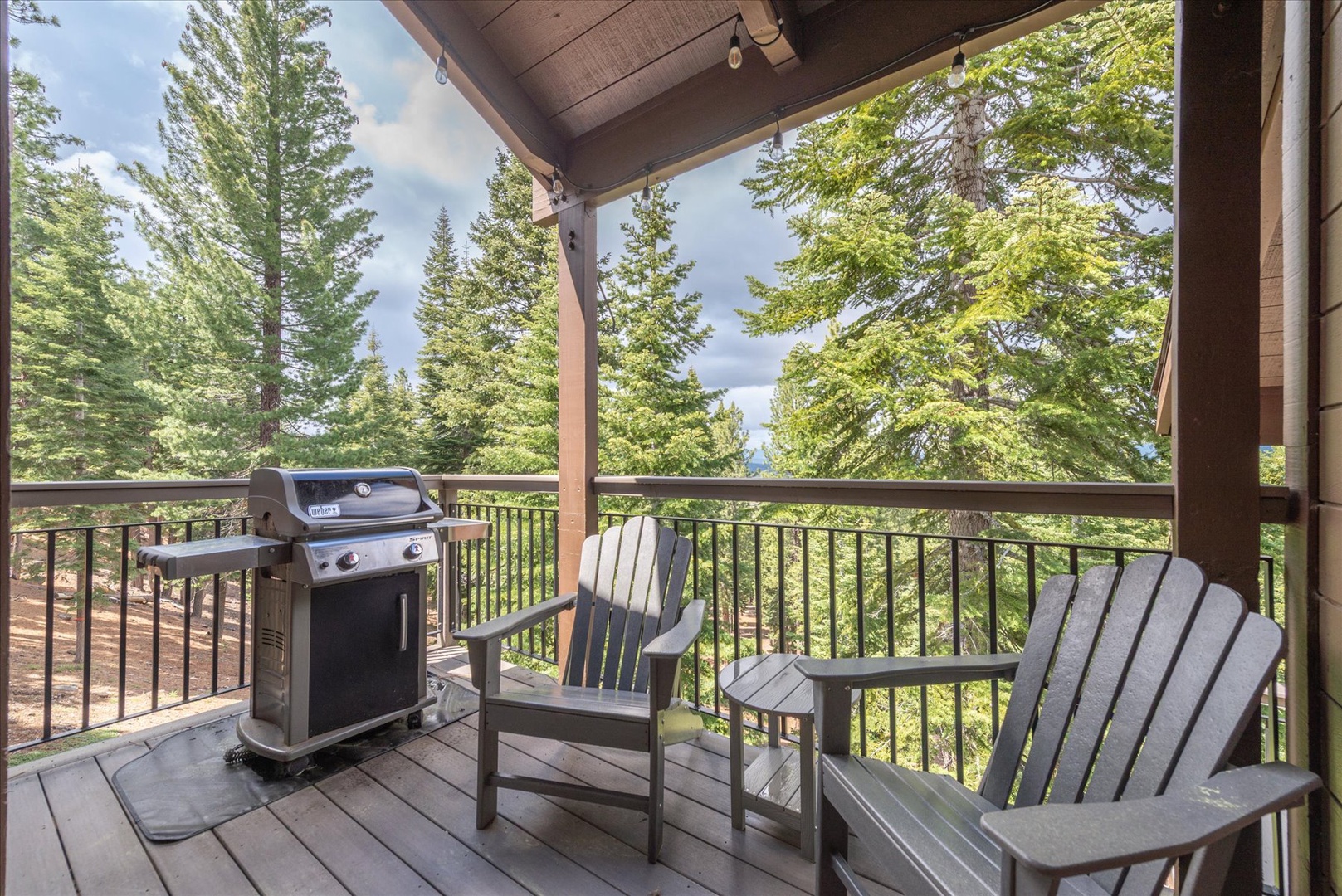 Step onto your private covered deck where Adirondack chairs invite you to relax with morning coffee. Fire up the gas grill for an effortless outdoor meal surrounded by towering pines and mountain tranquility.