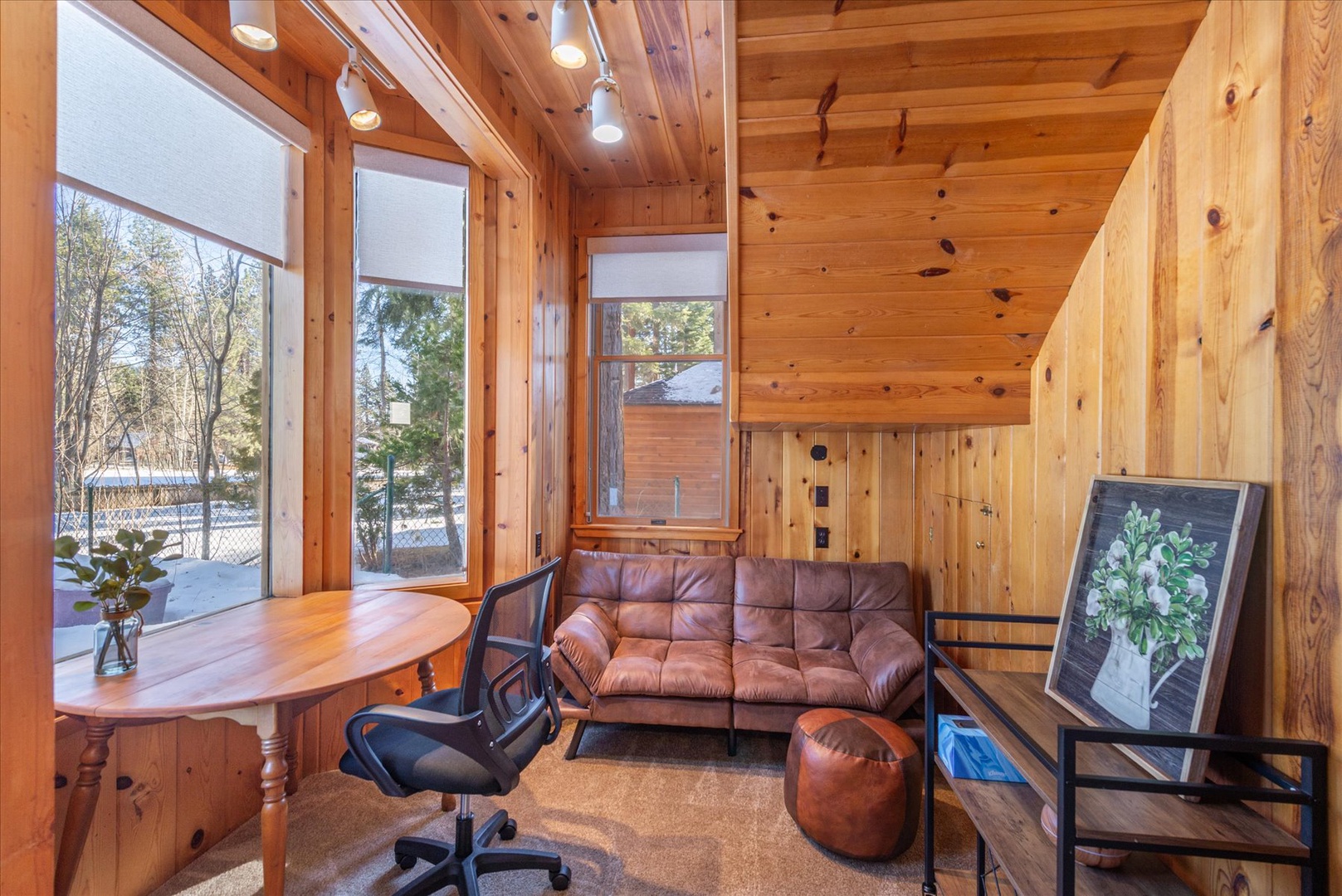 This sunken alcove offers additional living space under large windows with streaming natural light.