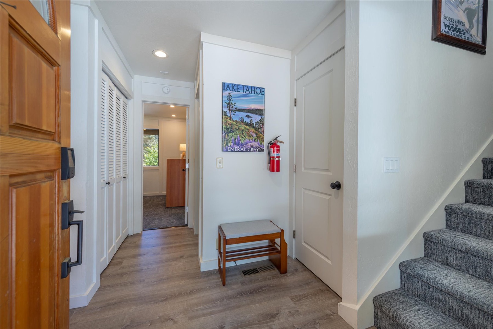 Step inside to a bright, welcoming entryway with warm wood tones, modern flooring, and thoughtful touches that make you feel right at home.