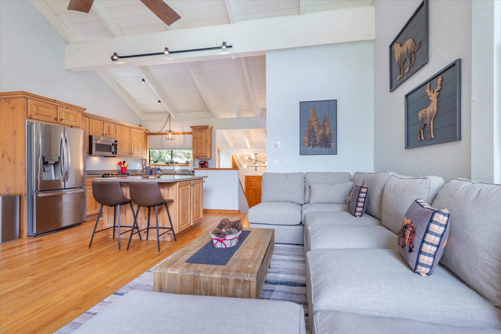 The comfortable and spacious open-concept living room offers a great place to relax and connect after your adventures.