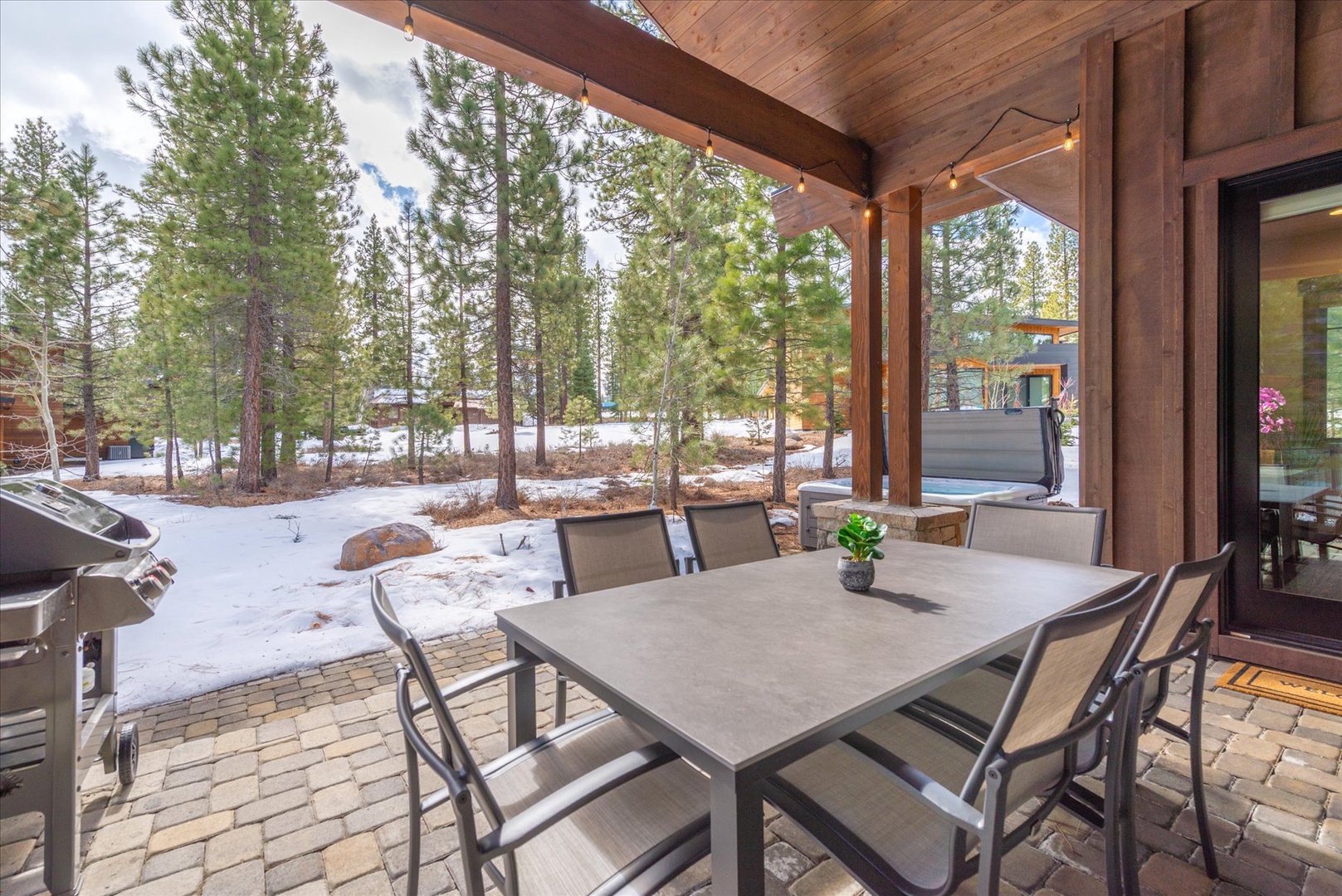 Gather around your private dining table on this covered patio, where forest views and fresh mountain air create the perfect backdrop for memorable meals together.