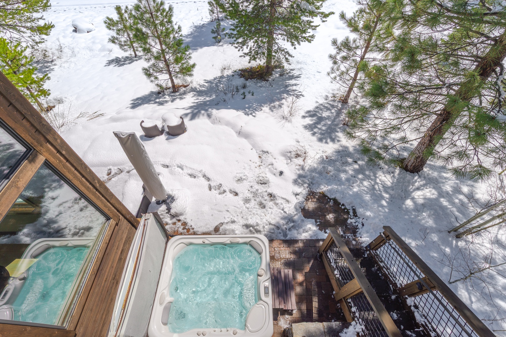 Soak in your private hot tub surrounded by pristine winter wonderland - the perfect mountain retreat after snowy adventures.