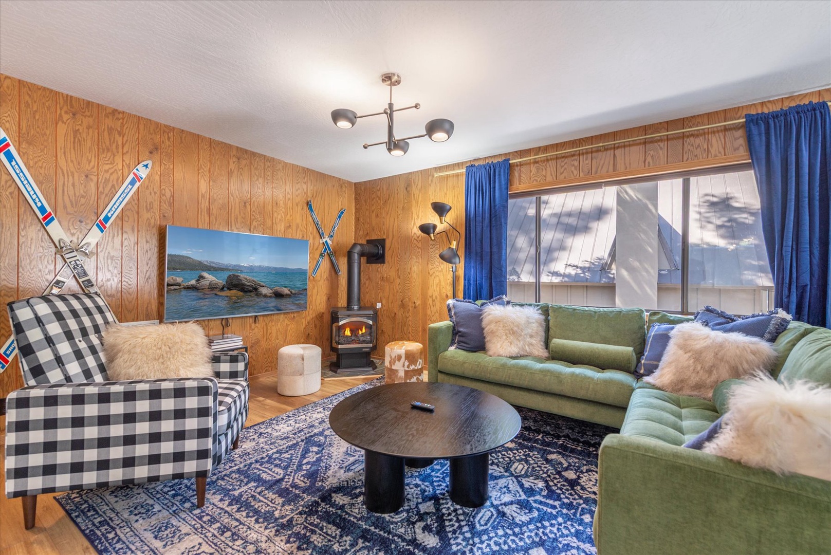 Cozy up in your curated mountain retreat living room with plush seating, fireplace, smart tv, and charming alpine décor.