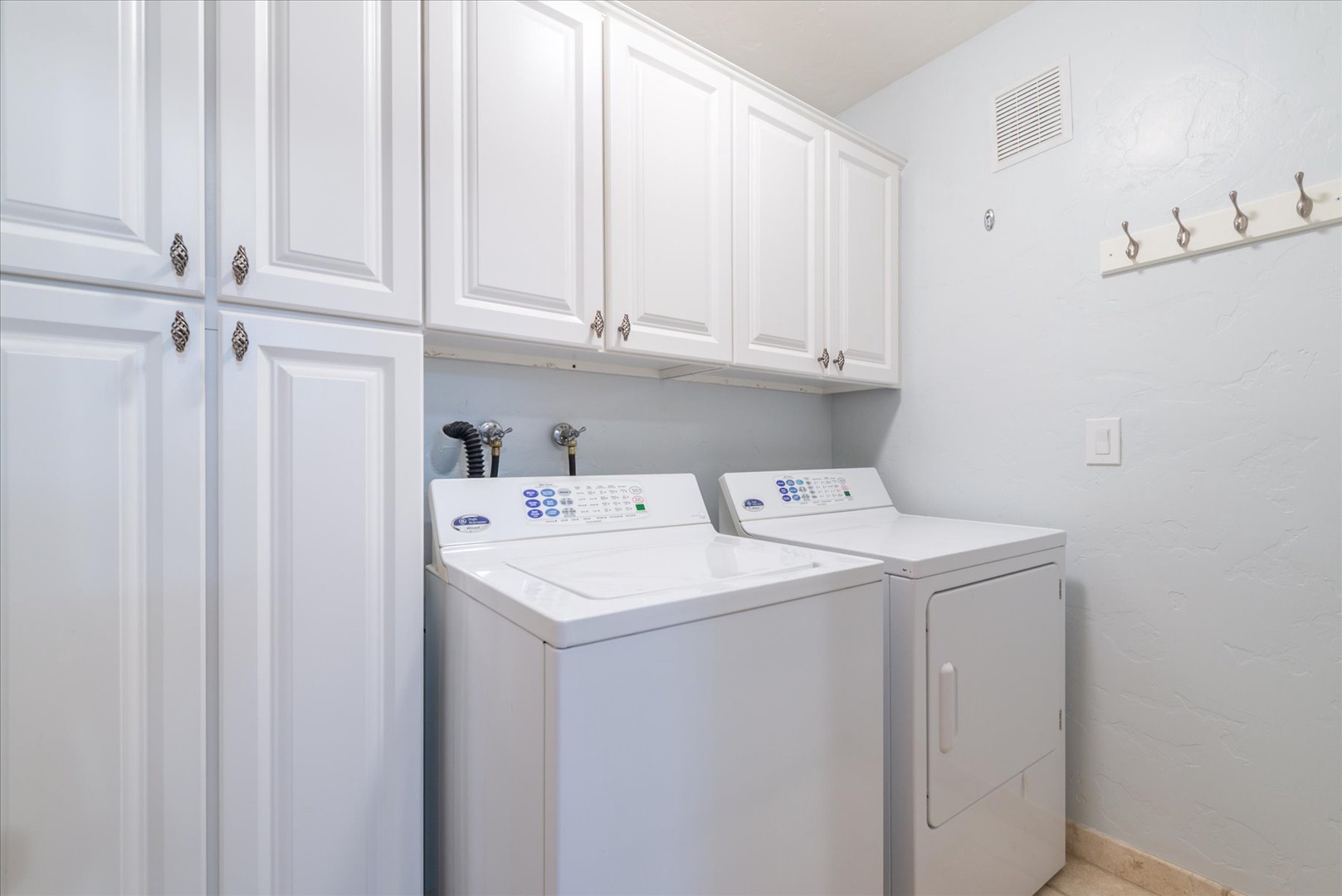 You'll love the convenience of having your own in-unit washer and dryer, with plenty of cabinet storage with laundry detergent pods provided.