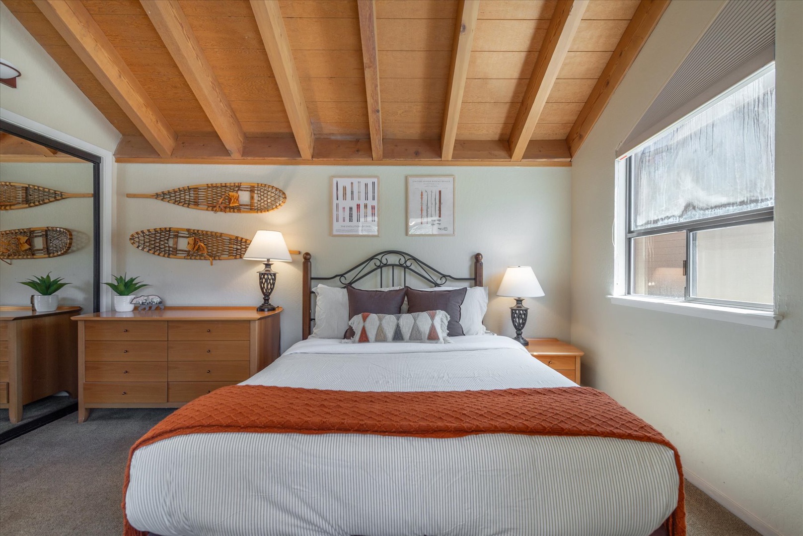 Slip into your cozy retreat with rustic wood beam ceilings, natural light streaming through large windows, and charming snowshoe decor that captures mountain charm perfectly.