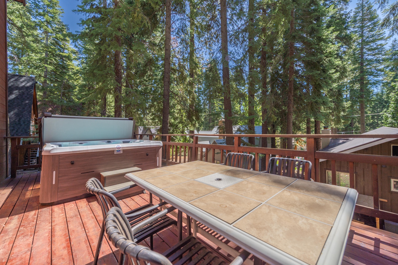 Unwind on your private deck surrounded by towering pines—soak in the hot tub, dine al fresco, and breathe in the fresh mountain air.