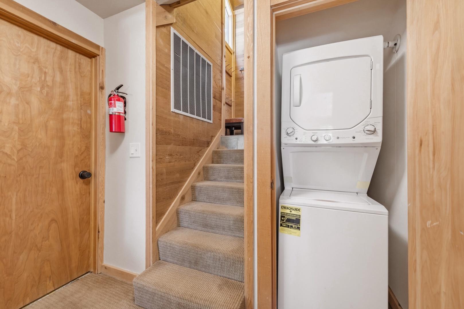 Your laundry essentials are close by, with a stacked washer and dryer tucked conveniently in the hallway—because fresh towels and clean clothes make a vacation even better.