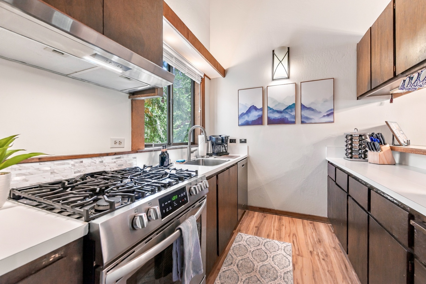Step into your fully equipped kitchen where morning coffee and home-cooked meals feel effortless. Natural light streams through the window, inviting you to prepare and savor every bite in this warm, thoughtfully designed space.