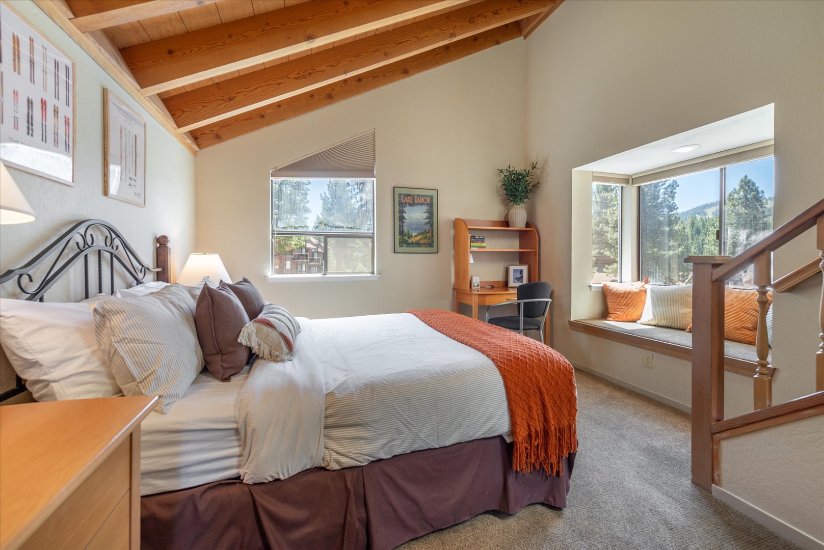 Drift off under stunning exposed beams and wake to forest views framing your window—your peaceful mountain retreat awaits with cozy textures and natural light.