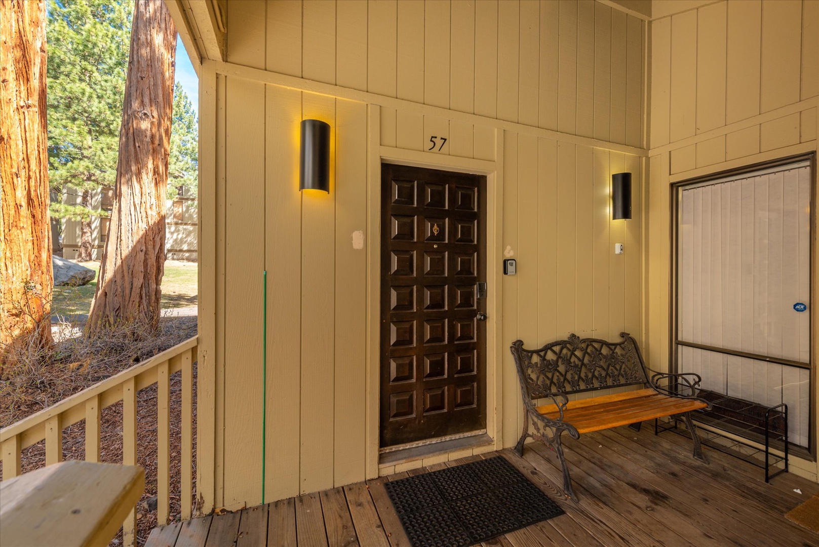 Your front porch entrance where decorative lighting welcomes you home after mountain adventures.