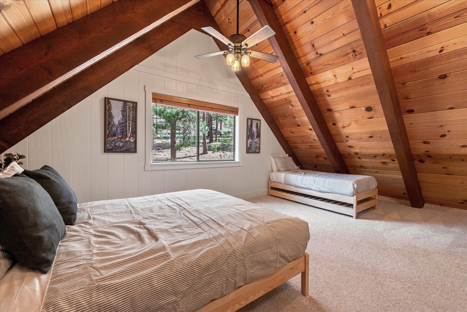 Room for the whole family with a queen bed and two stacking twin beds.