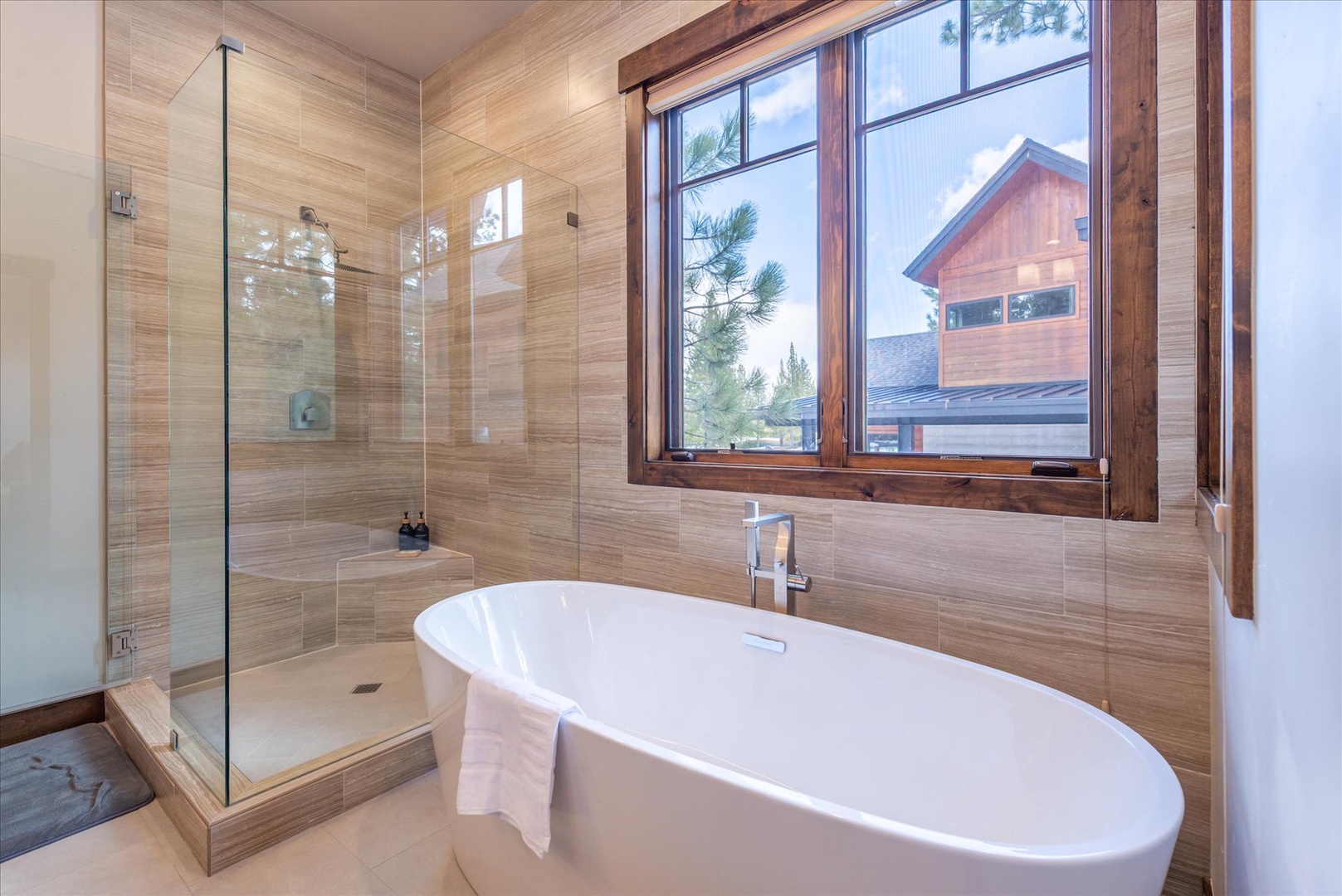 Unwind in your spa-like bathroom with a luxurious soaking tub and glass-enclosed showert.