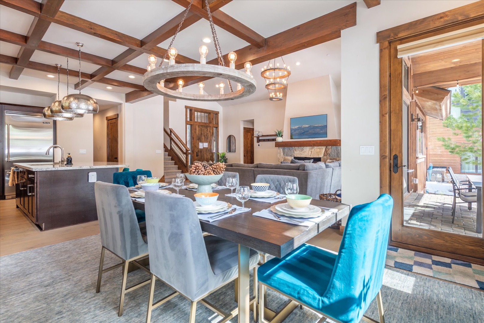 Gather around your elegant dining table where rustic beams meet modern comfort, creating the perfect space for memorable meals together.