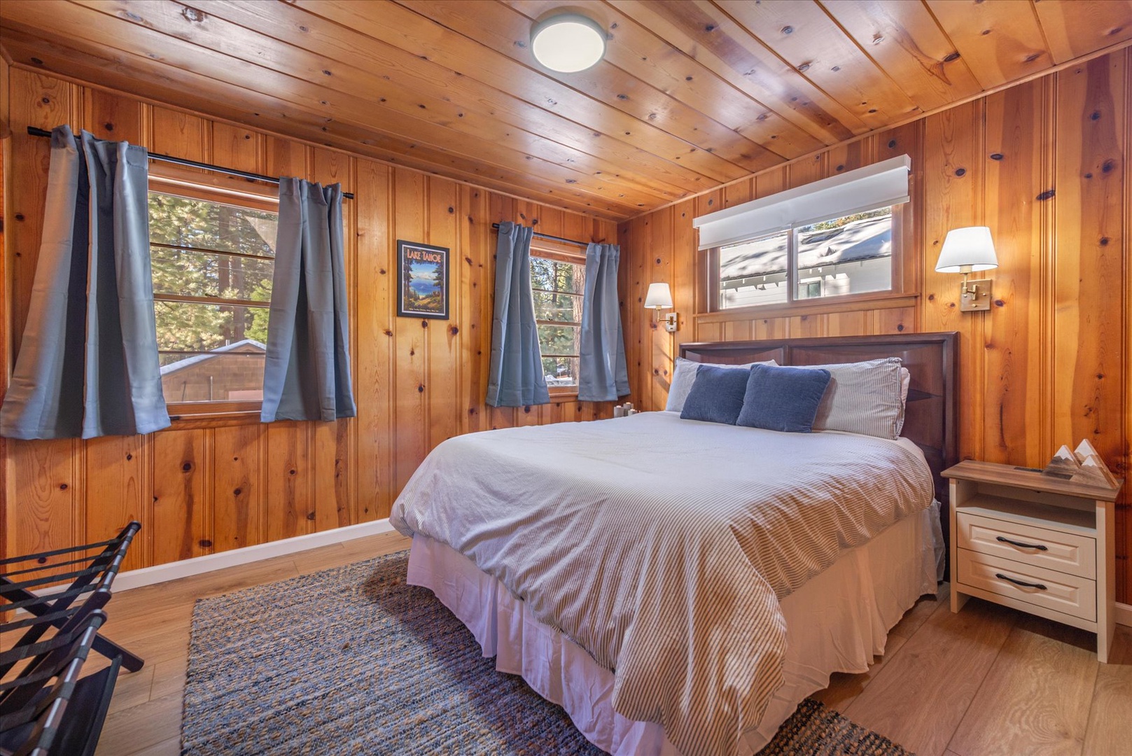 Drift off to peaceful sleep in this cozy cabin-feel bedroom with a plush queen bed.